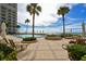 Relaxing pool area with lounge chairs and ocean views at 2301 Gulf Of Mexico Dr # 52N, Longboat Key, FL 34228