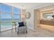 Relaxing sitting area with ocean views and comfy chair at 2301 Gulf Of Mexico Dr # 52N, Longboat Key, FL 34228