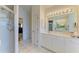 Bright bathroom boasts double sinks, a large shower, and a separate tub at 232 Venice Palms Blvd, Venice, FL 34292