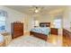 Bedroom with wooden dresser and ceiling fan at 232 Venice Palms Blvd, Venice, FL 34292