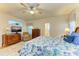 Main bedroom with large bed and sitting area at 232 Venice Palms Blvd, Venice, FL 34292