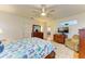 Main bedroom with dresser and TV at 232 Venice Palms Blvd, Venice, FL 34292