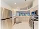 Modern kitchen with stainless steel appliances and view to backyard at 232 Venice Palms Blvd, Venice, FL 34292