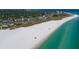 Beachfront property with white sand and clear water at 2335 Novus St, Sarasota, FL 34237