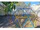 Backyard with a climbing dome playset at 2335 Novus St, Sarasota, FL 34237