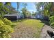 Backyard view showcasing a hot tub and play area at 2335 Novus St, Sarasota, FL 34237