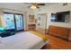 Bedroom with private balcony, laundry, and hardwood floors at 2335 Novus St, Sarasota, FL 34237