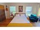 Bright bedroom with mid-century modern furniture and hardwood floors at 2335 Novus St, Sarasota, FL 34237