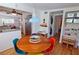 Bright dining area with mid-century modern table and chairs, opens to kitchen at 2335 Novus St, Sarasota, FL 34237