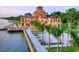 Waterfront mansion with palm trees and manicured grounds at 2335 Novus St, Sarasota, FL 34237