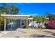 Cute bungalow with carport, and a landscaped front yard at 2335 Novus St, Sarasota, FL 34237