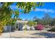 Cute bungalow exterior with a covered entry and landscaped yard at 2335 Novus St, Sarasota, FL 34237