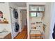 Convenient laundry room with stackable washer and dryer, plus craft area at 2335 Novus St, Sarasota, FL 34237