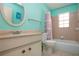 Bright bathroom with vanity, toilet, and bathtub at 2413 Aspinwall St # 2413, Sarasota, FL 34237