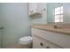 Small bathroom with white vanity and toilet at 2413 Aspinwall St # 2413, Sarasota, FL 34237