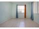 Bedroom with teal walls and tile floors at 2413 Aspinwall St # 2413, Sarasota, FL 34237