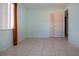 Bedroom with teal walls and tile floors at 2413 Aspinwall St # 2413, Sarasota, FL 34237