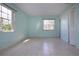 Empty bedroom with light teal walls and tile floors at 2413 Aspinwall St # 2413, Sarasota, FL 34237