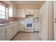 White kitchen with appliances and ample cabinetry at 2413 Aspinwall St # 2413, Sarasota, FL 34237