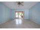 Living room with tile floors and sliding glass doors at 2413 Aspinwall St # 2413, Sarasota, FL 34237