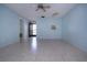 Spacious living area with tile floors and a door at 2413 Aspinwall St # 2413, Sarasota, FL 34237