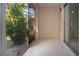 Enclosed patio with sliding glass doors and view of greenery at 2413 Aspinwall St # 2413, Sarasota, FL 34237