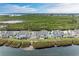 Row of waterfront homes with private patios at 25 Tidy Island Blvd, Bradenton, FL 34210