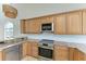 Modern kitchen with stainless steel appliances and granite countertops at 25 Tidy Island Blvd # 25, Bradenton, FL 34210