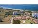 Aerial view showcasing a villa's location near a golf course and body of water at 2608 Edgewater Ct, Palmetto, FL 34221