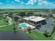 Aerial view of the community clubhouse, swimming pool and golf course at 2608 Edgewater Ct, Palmetto, FL 34221