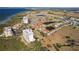 Aerial view of waterfront community, showcasing home near golf course and lake at 2608 Edgewater Ct, Palmetto, FL 34221