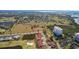 Aerial view of the waterfront community with golf course, ponds, and lush landscaping at 2608 Edgewater Ct, Palmetto, FL 34221