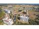 Aerial view of the waterfront community with ponds, lush landscaping, and multiple buildings at 2608 Edgewater Ct, Palmetto, FL 34221