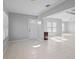 Bright and airy living room with tile floors and neutral color palette at 2608 Edgewater Ct, Palmetto, FL 34221