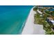 Aerial view of pristine beach and coastline at 3240 Gulf Of Mexico Dr # B104, Longboat Key, FL 34228