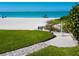 Beach access with shower and walkway at 3240 Gulf Of Mexico Dr # B104, Longboat Key, FL 34228