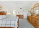 Comfortable bedroom with king-size bed and ample dresser space at 3240 Gulf Of Mexico Dr # B104, Longboat Key, FL 34228