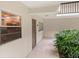 Condo entryway with tiled floor and potted plant at 3240 Gulf Of Mexico Dr # B104, Longboat Key, FL 34228