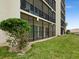 Building exterior showcasing a condo with a screened balcony at 3240 Gulf Of Mexico Dr # B104, Longboat Key, FL 34228