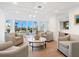 Bright and airy community clubhouse with seating area at 3240 Gulf Of Mexico Dr # B104, Longboat Key, FL 34228