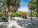 Playground with play structures and swings at 3240 Gulf Of Mexico Dr # B104, Longboat Key, FL 34228