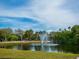 Scenic pond with a central fountain at 3240 Gulf Of Mexico Dr # B104, Longboat Key, FL 34228