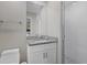 Modern bathroom with granite vanity and walk-in shower at 330 Caruso Pl, Sarasota, FL 34237