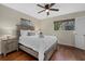 Bedroom with queen bed, nightstand and hardwood floors at 330 Caruso Pl, Sarasota, FL 34237