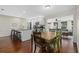 Dining area with wood table and chairs, open to the living room at 330 Caruso Pl, Sarasota, FL 34237