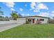 Newly renovated home with modern facade and well-manicured lawn at 330 Caruso Pl, Sarasota, FL 34237