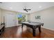 Pool table in a well-lit game room with hardwood floors at 330 Caruso Pl, Sarasota, FL 34237