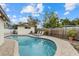 Inviting kidney-shaped pool with lounge chairs and a spacious patio at 330 Caruso Pl, Sarasota, FL 34237