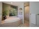 Bathroom with soaking tub and walk-in shower at 3395 Hardee Dr, Venice, FL 34292