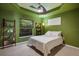 Green bedroom with window at 3395 Hardee Dr, Venice, FL 34292